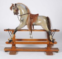 Lot 1311 - An early 20th Century painted wooden rocking...