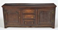 Lot 1351 - A George III oak dresser, fitted three short...