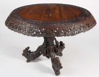 Lot 1353 - A Burmese carved hardwood circular-shaped...