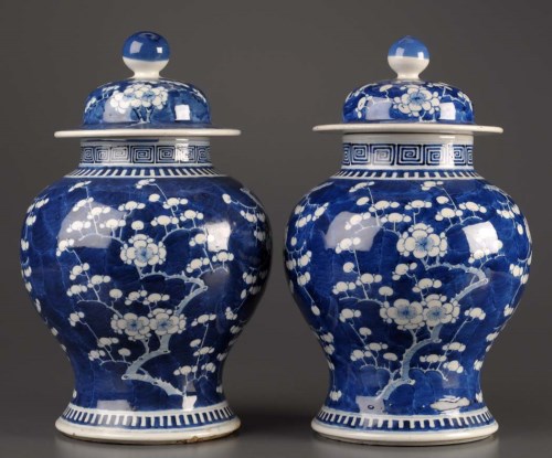 Lot 18 - A pair of blue and white covered baluster...