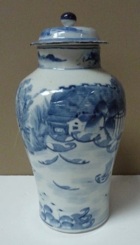 Lot 21 - A blue and white baluster vase, painted with a...