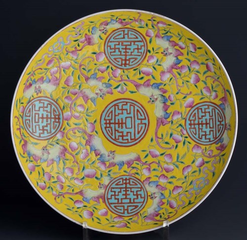 Lot 26 - A yellow ground charger, painted with five...