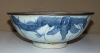 Lot 37 - A blue and white provincial bowl, the exterior...
