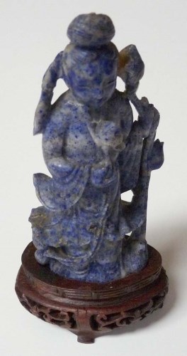 Lot 56 - A carved lapis lazuli figure of Guanyin, shown...