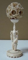 Lot 63 - An ivory puzzle ball and stand, the well...