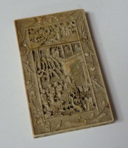 Lot 64 - An ivory card case, finely carved with figures...