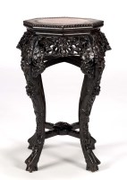 Lot 68 - A Chinese carved hardwood octagonal low table,...