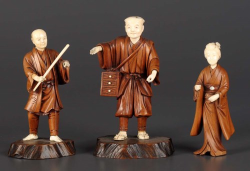 Lot 76 - Three carved ivory and wood okimono, each with...