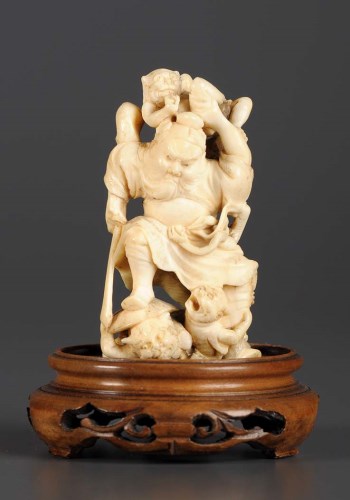 Lot 78 - A carved ivory okimono of Shoki and three Oni...