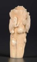 Lot 79 - A carved ivory cane finial, modelled as a tree...