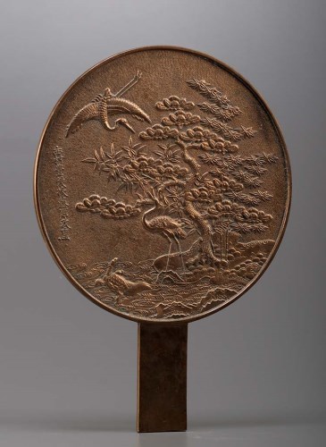 Lot 85 - A bronze mirror, of typical form, having a...