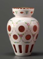 Lot 97 - A ruby and white cut and cased vase, of...