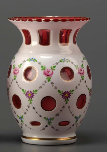 Lot 98 - A ruby and white cut and cased vase, of...