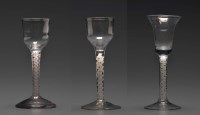 Lot 102 - Three 18th Century wine glasses, all raised on...