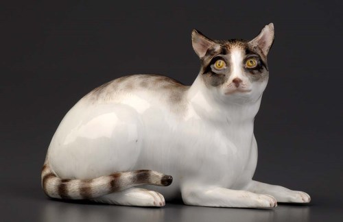 Lot 130 - Meissen: a model of a recumbent cat, white...
