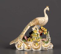 Lot 146 - Bloor Derby: a model of a peacock on a floral...