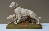 Lot 158 - Royal Dux: a figure group of two dogs on a...