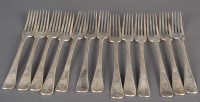 Lot 570 - A set of twelve Victorian table forks, by Reid...