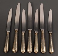 Lot 592 - Ten steel table knives, by Garrard & Co., with...