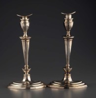 Lot 600 - A pair of Edwardian candlesticks, by the...