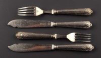 Lot 612 - A set of twelve early 20th Century plated fish...