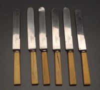 Lot 617 - A quantity of table knives, the plain ivory...