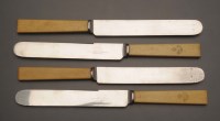 Lot 620 - A set of twelve table knives, the ivory...