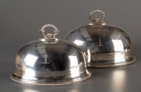 Lot 661 - A pair of plated meat covers, by William...