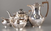 Lot 680 - A four-piece George V tea service, by James...