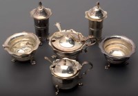 Lot 725 - A five-piece Edwardian condiment set, by Levi...