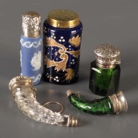 Lot 749 - Two cut glass and white metal mounted scent...