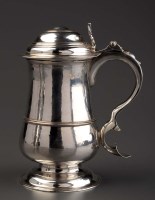 Lot 775 - An early George III lidded tankard, by James...