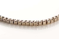 Lot 853 - A diamond line bracelet, composed of a uniform...