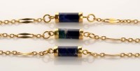 Lot 855 - A lapis lazuli necklace, the five barrel...