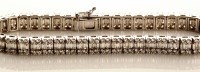 Lot 860 - A diamond line bracelet, the central row of...