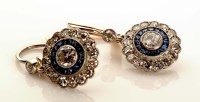 Lot 870 - A pair of sapphire and diamond earrings, of...