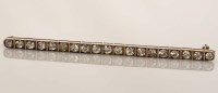 Lot 872 - A diamond bar brooch, c.1910, composed of a...