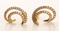 Lot 883 - A pair of diamond and gold earrings, of double...