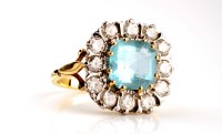 Lot 884 - An aquamarine and diamond ring, the step cut...