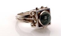 Lot 887 - An agate and silver ring, the circular...