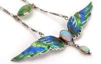 Lot 890 - An Art Nouveau enamel and opal pendant, cica...