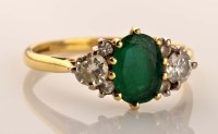 Lot 900 - An emerald diamond ring, the central oval...