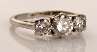 Lot 901 - A three stone diamond ring, the three slightly...