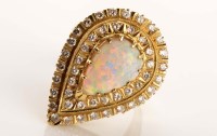 Lot 904 - An opal and diamond ring, pear-shaped cabochon...