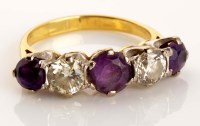 Lot 905 - An amethyst and diamond ring, the three...