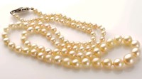 Lot 914 - A cultured pearl necklace, the graduating row...