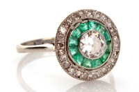 Lot 915 - An Edwardian diamond and emerald ring, the...