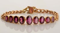 Lot 919 - A late Victorian amethyst and gold bracelet, c....