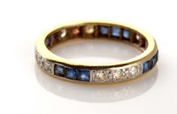 Lot 932 - A sapphire and diamond eternity ring, set with...