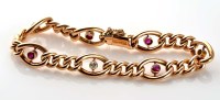 Lot 945 - A late Victorian ruby, diamond and gold...